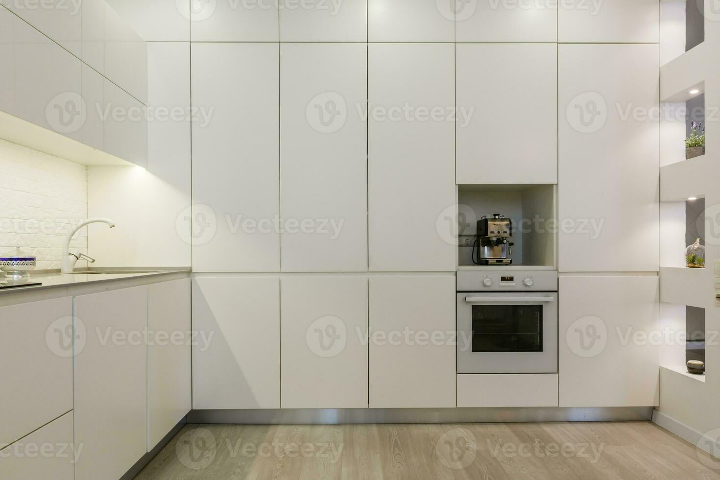 Modern white kitchen without handles photo