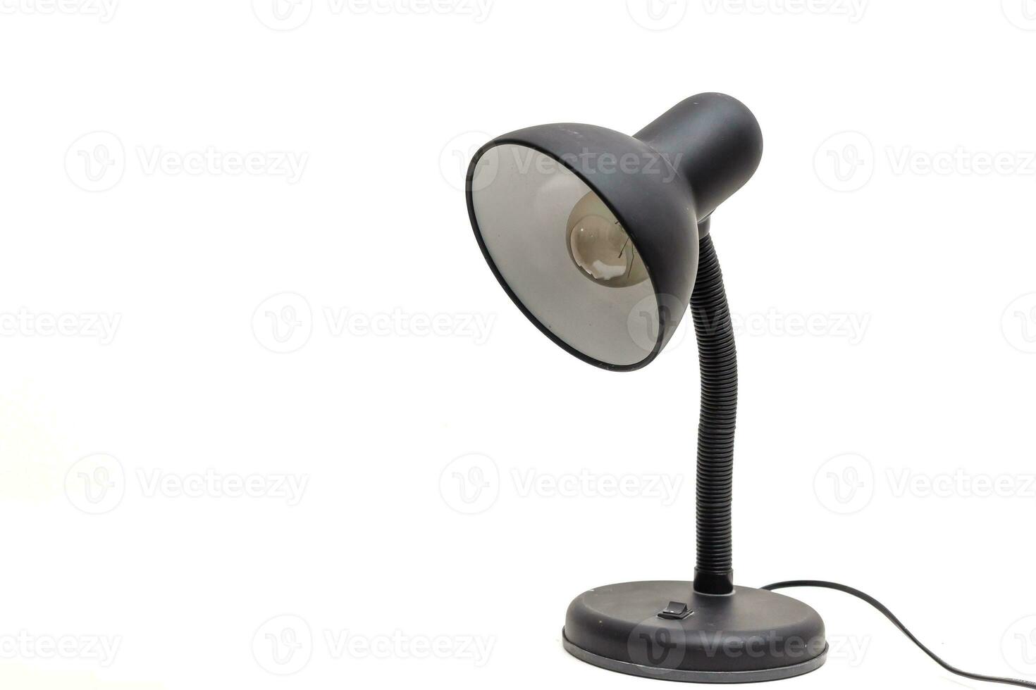 Vintage black desk lamp isolated on white photo