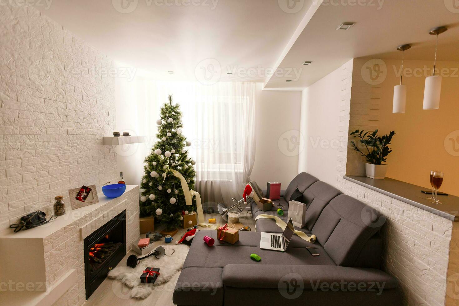 Messy living room interior with Christmas tree. Chaos after party photo