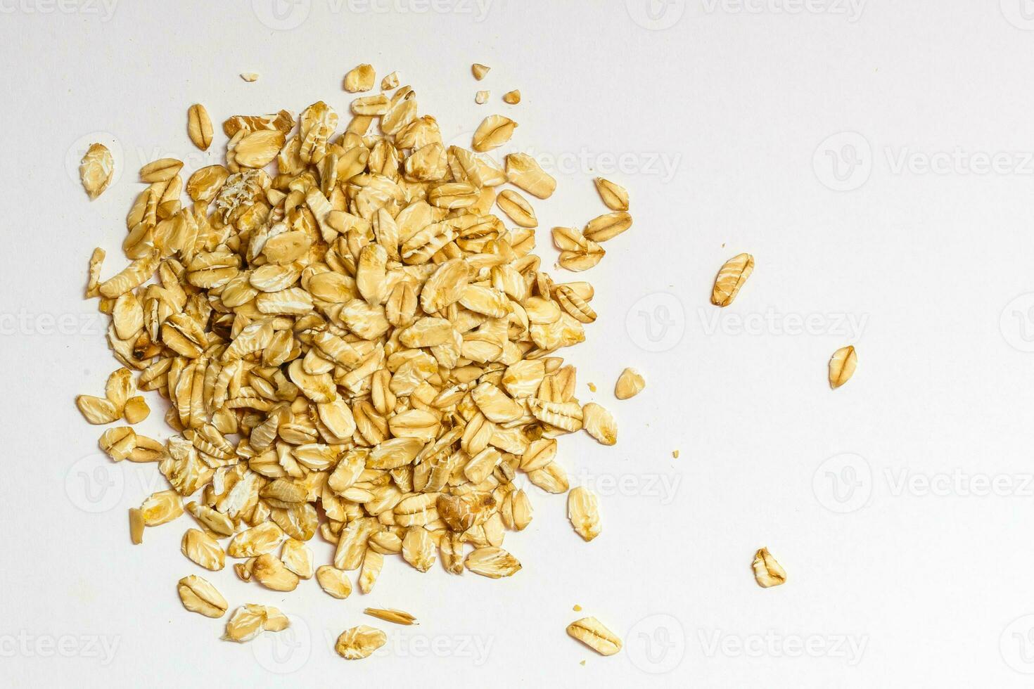 oat flakes isolated on white background. Top view photo