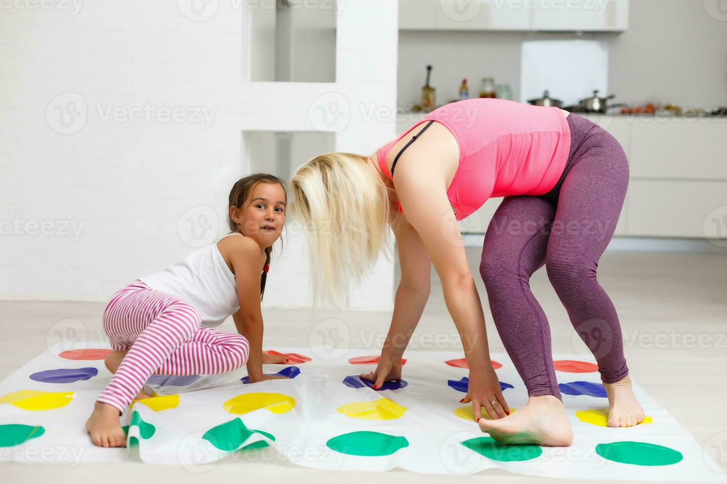 happy family having fun together, playing twister game at home photo