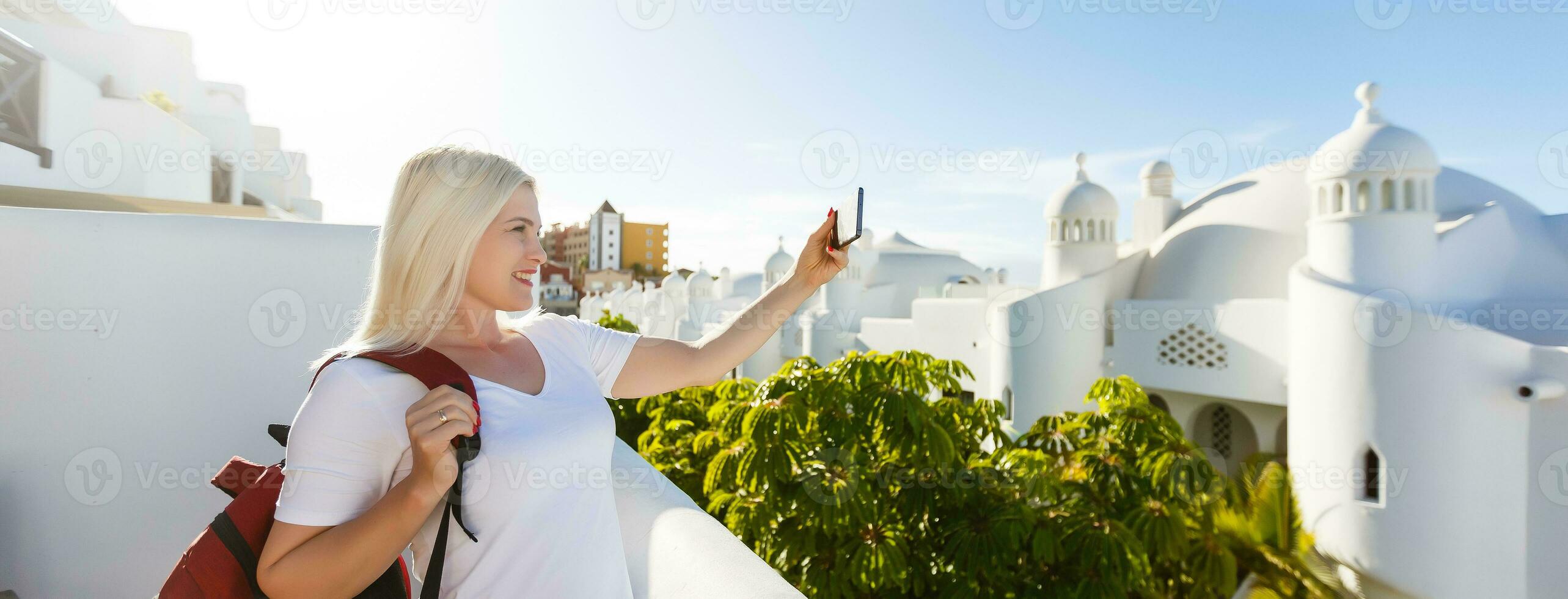 Traveller wearing a bag and white shirt exploring beautiful in Europe during summer sunset photo