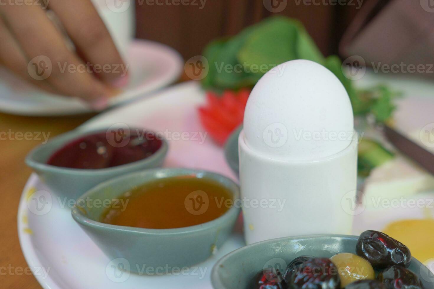 Close egg in cups for morning breakfast photo