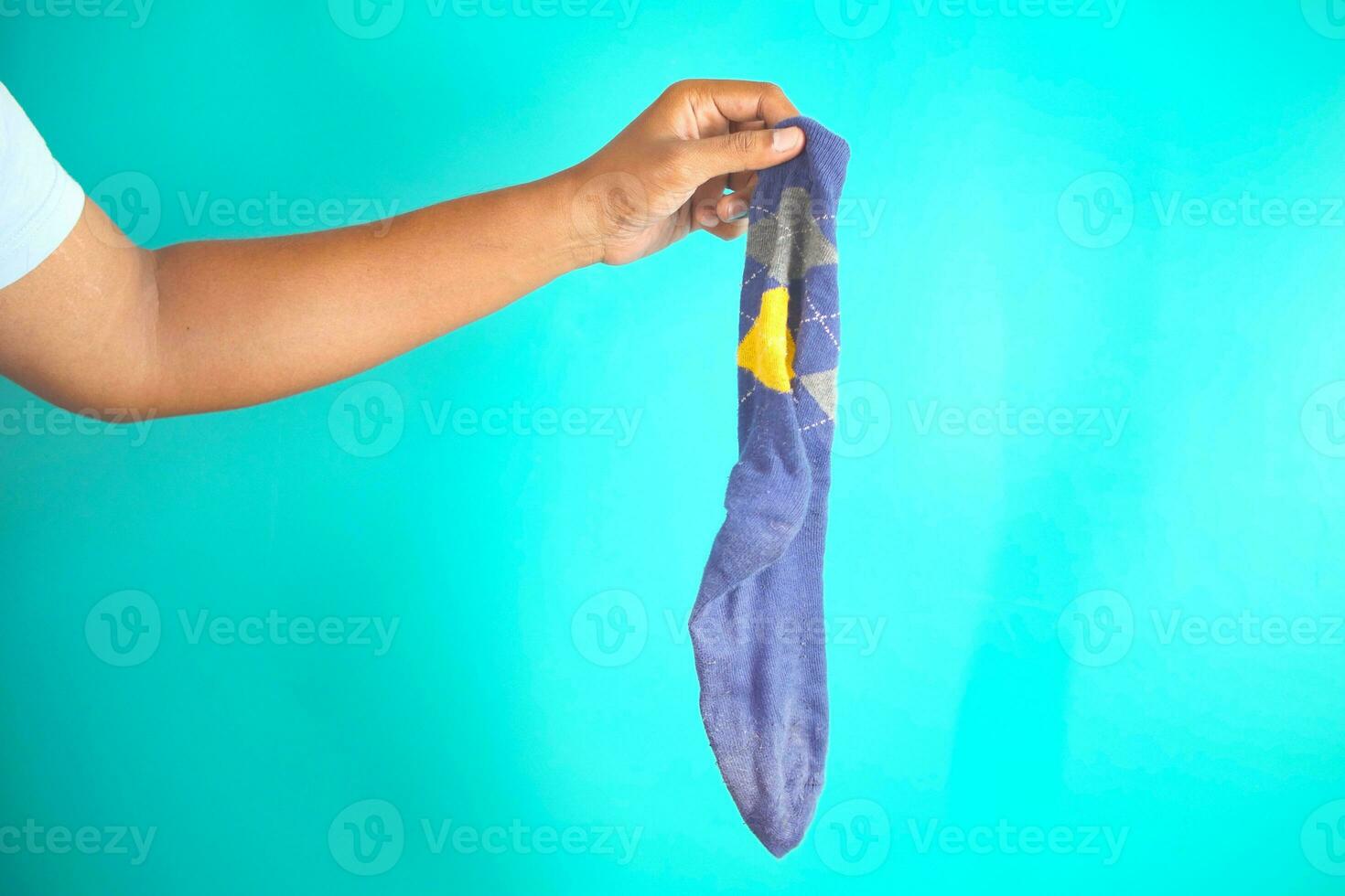 men holding a dirty sock photo