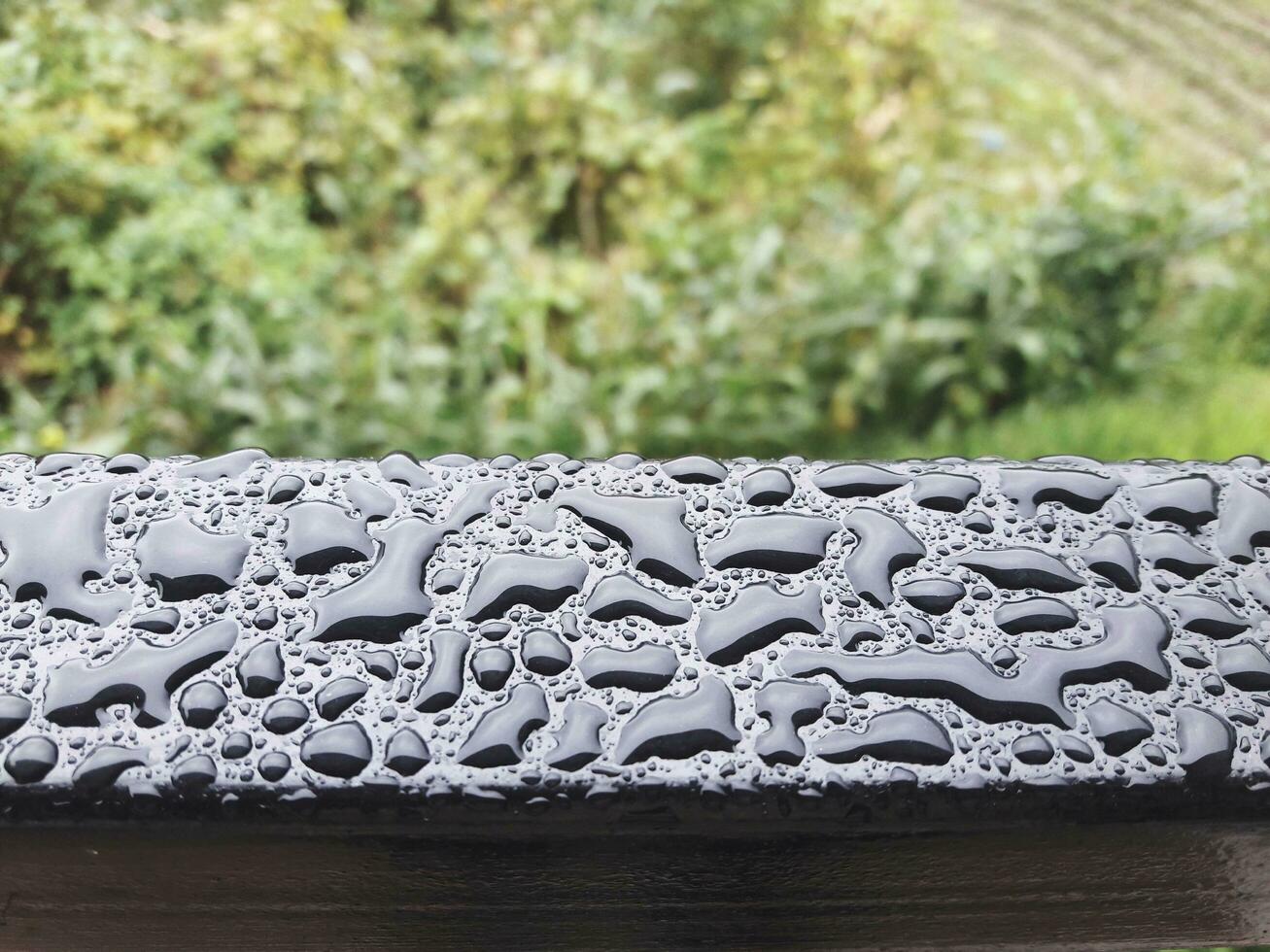 Water Droplet Patterns on Metal Bar photo