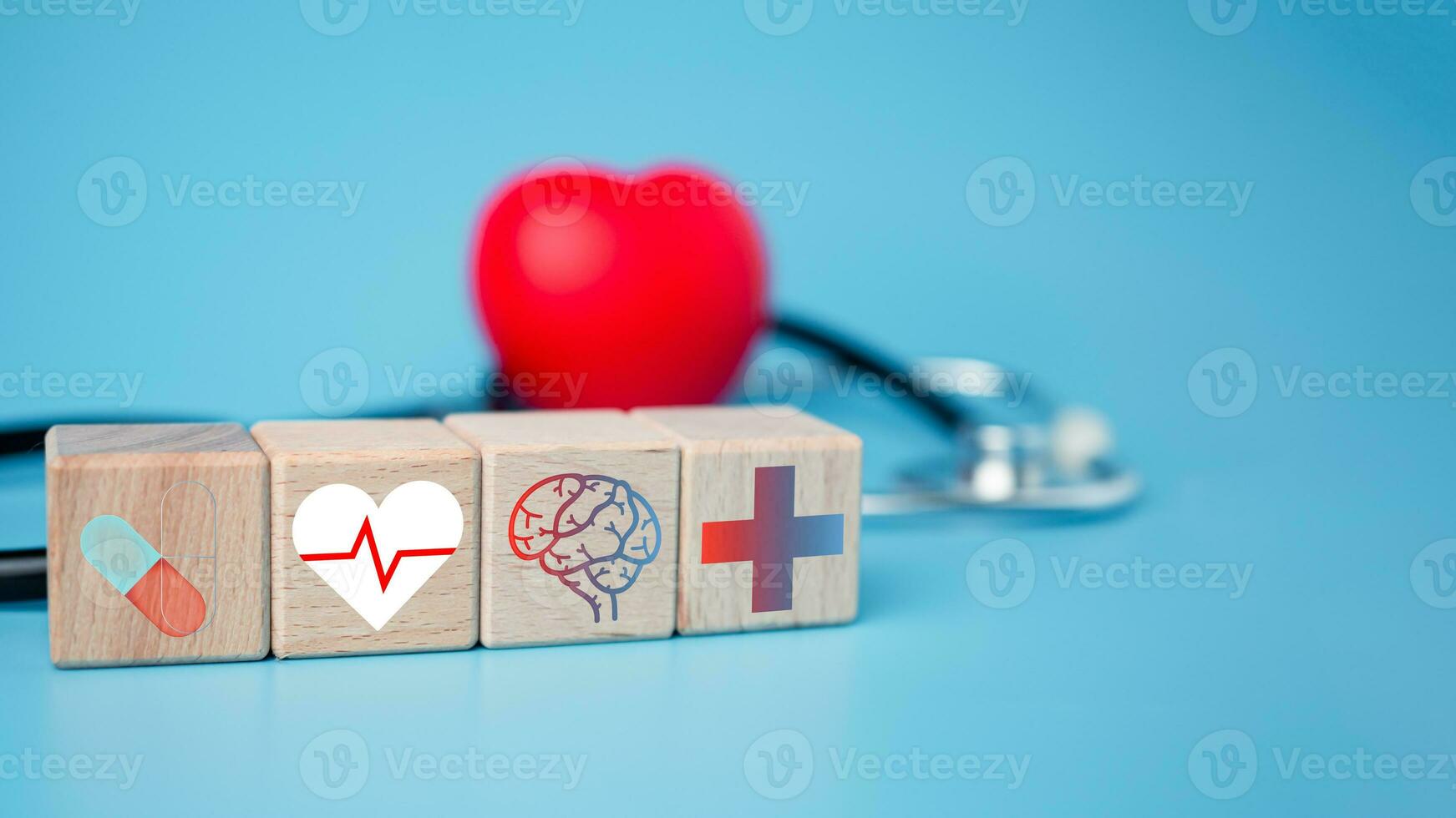 The concept of health insurance and medical welfare. Block wooden and red heart with plus icon. Health insurance and access to health care. photo