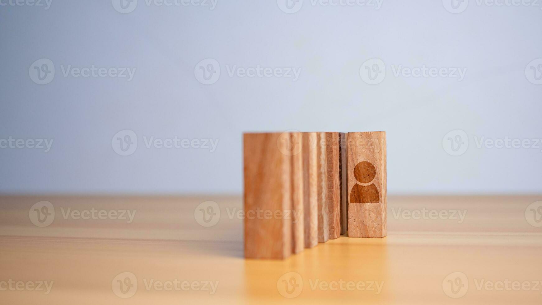 Concept of Business and HR for leadership and team leader. One cube wood out in front  Different and stand out from the group photo