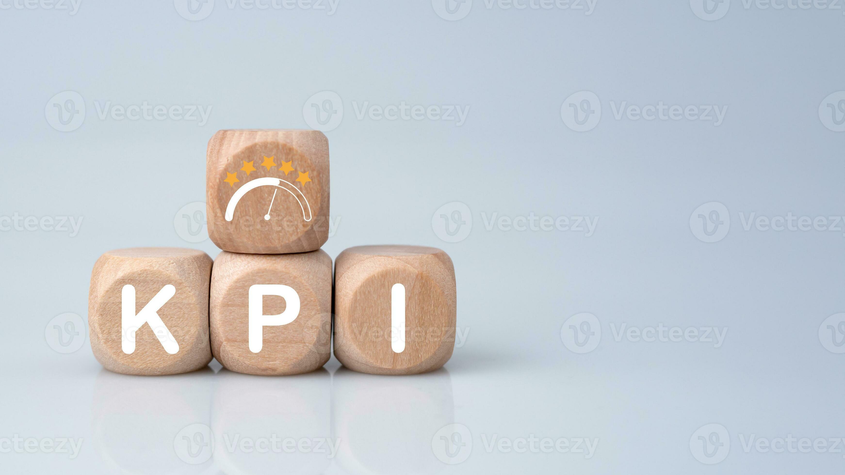Wooden cube block with KPI short for Key Performance Indicators on