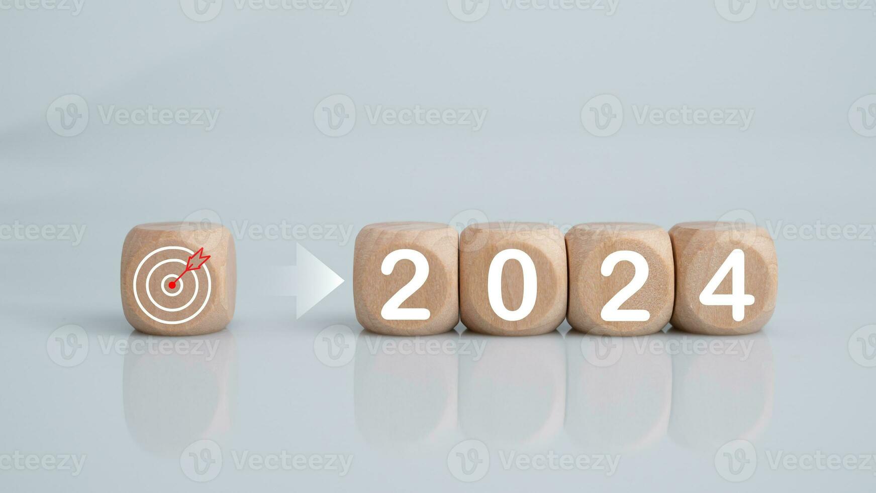 Wooden blocks lined up with the letters 2024. Represents the goal setting for 2024, the concept of a start. financial planning development strategy business goal setting photo