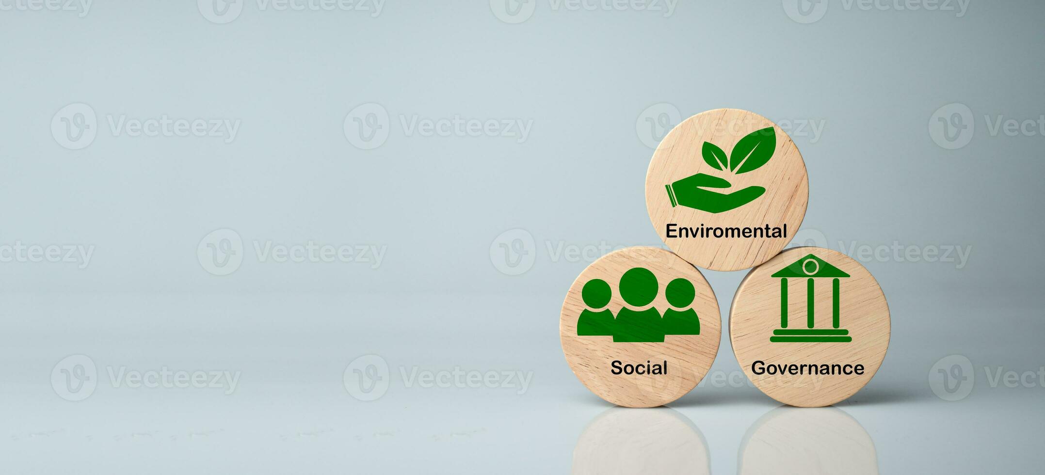 ESG concepts for sustainable environment, society and governance Businesses are environmentally responsible. A  wooden circular board with the abbreviation ESG printed on a white background. photo