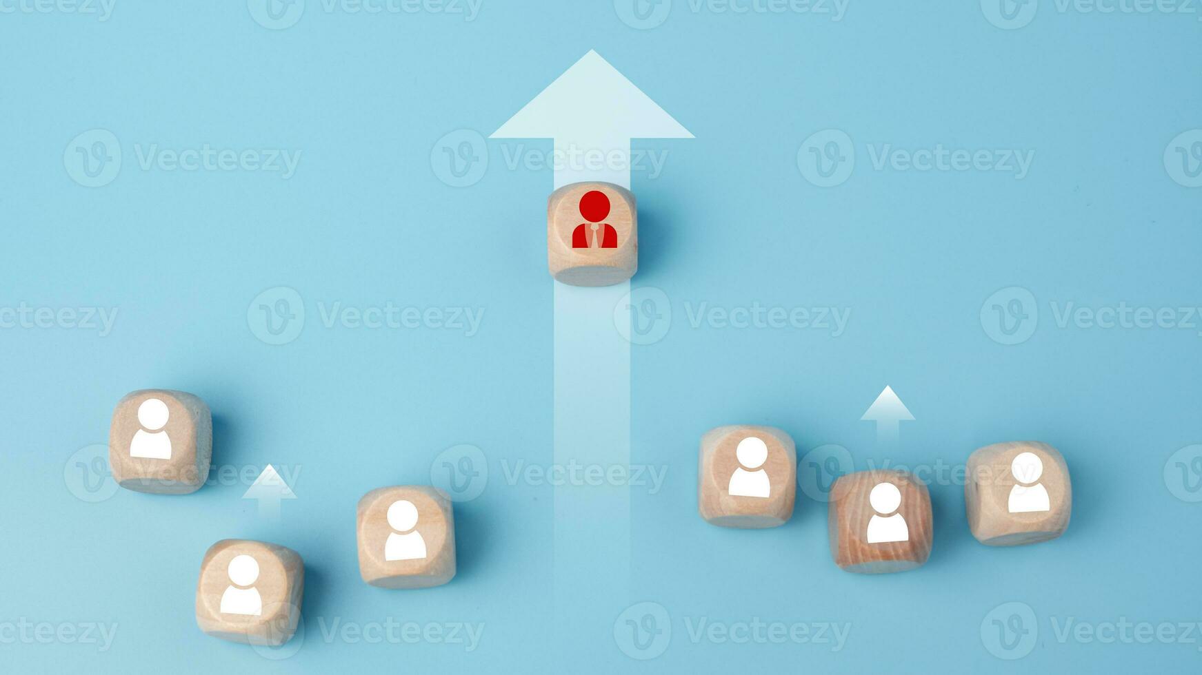 Leadership, business success, unique ideas, individuality, challenge, and motivation. Manager wooden block leads with rising arrow and followed by wooden block on blue background. photo