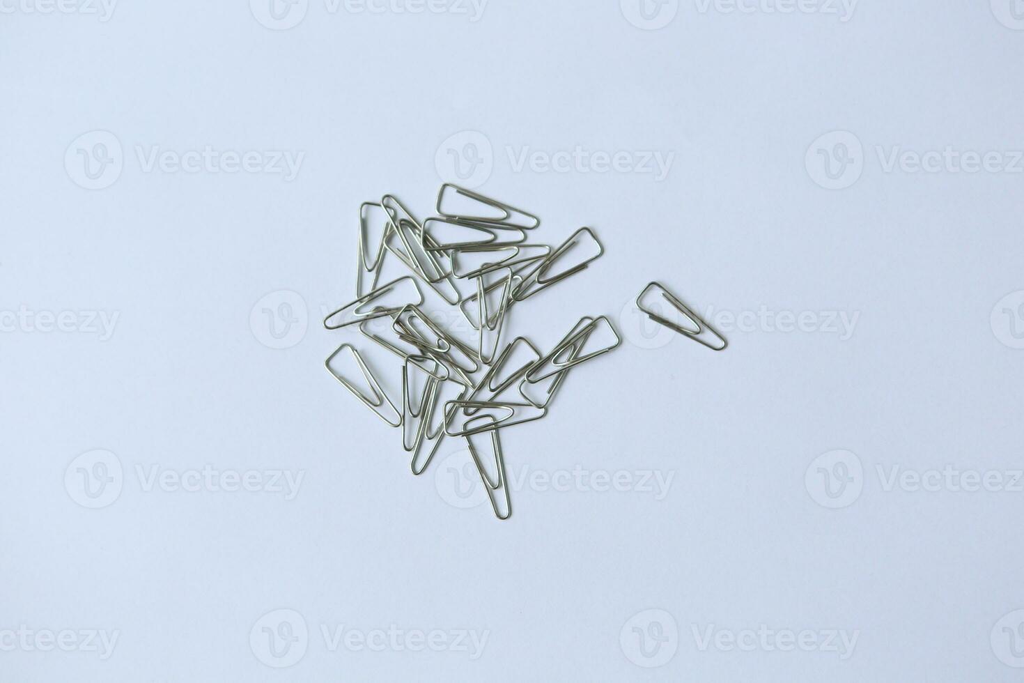 Trigonal clip, a triangular fastener, perfect for securing papers with style and efficiency in office or creative settings. photo