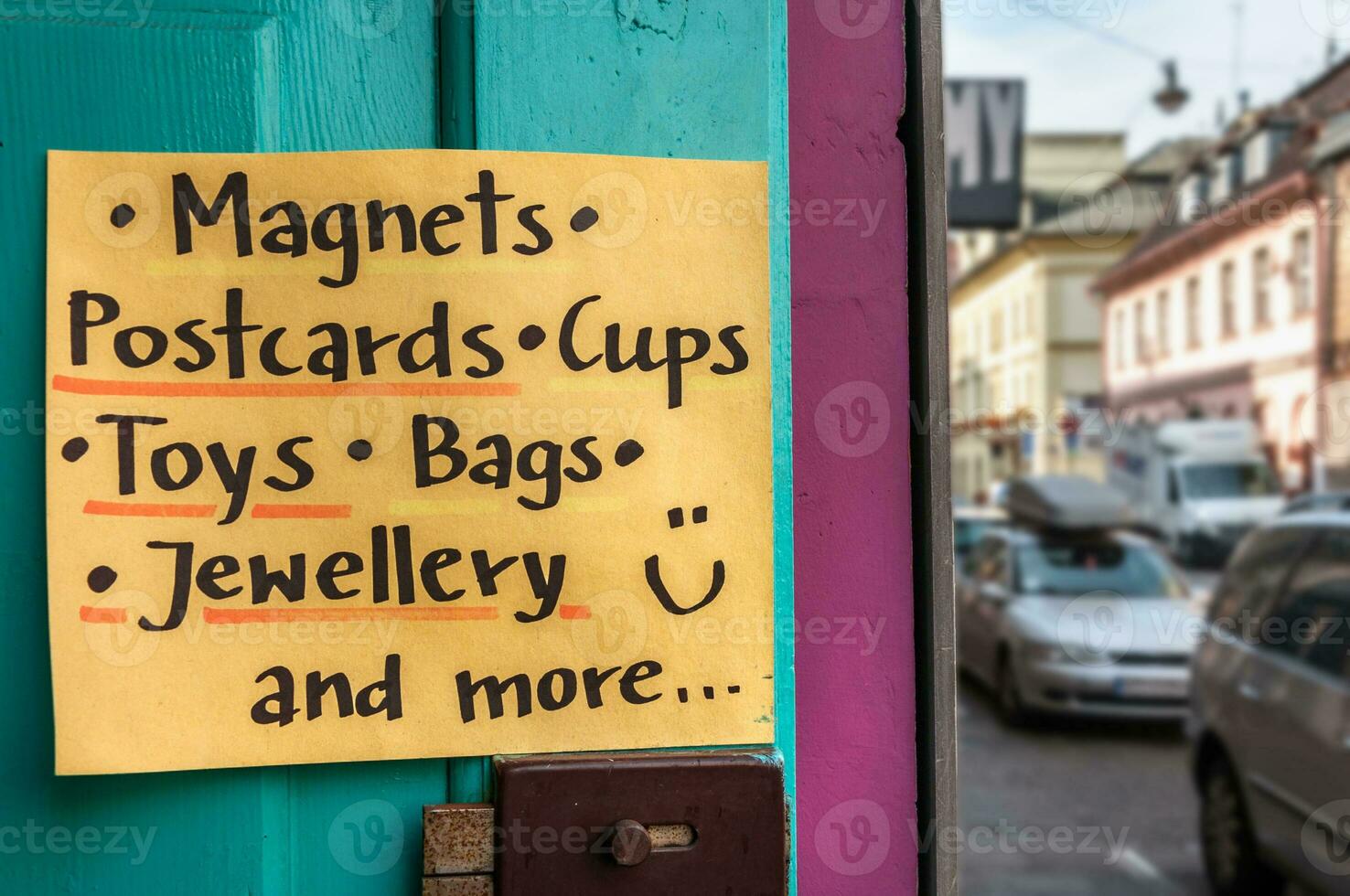 Yellow handwritten poster for souvenir shop photo