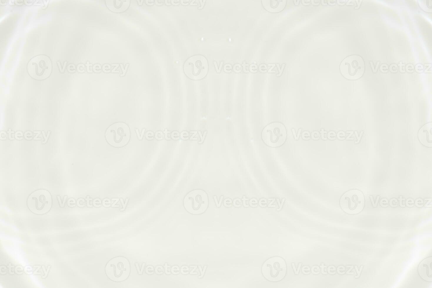 White water with ripples on the surface. Defocus blurred transparent white colored clear calm water surface texture with splashes and bubbles. Water waves with shining pattern texture background. photo