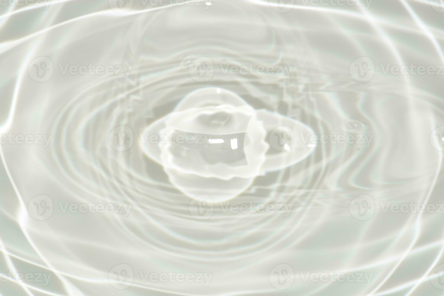 White water with ripples on the surface. Defocus blurred transparent white colored clear calm water surface texture with splashes and bubbles. Water waves with shining pattern texture background. photo