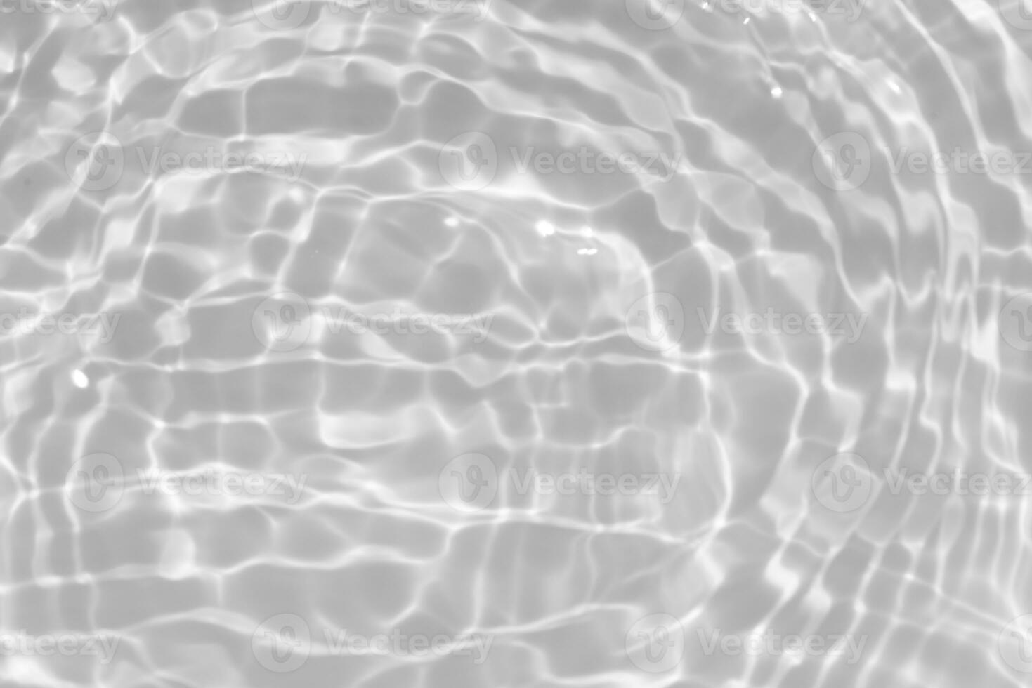 White water with ripples on the surface. Defocus blurred transparent white colored clear calm water surface texture with splashes and bubbles. Water waves with shining pattern texture background. photo