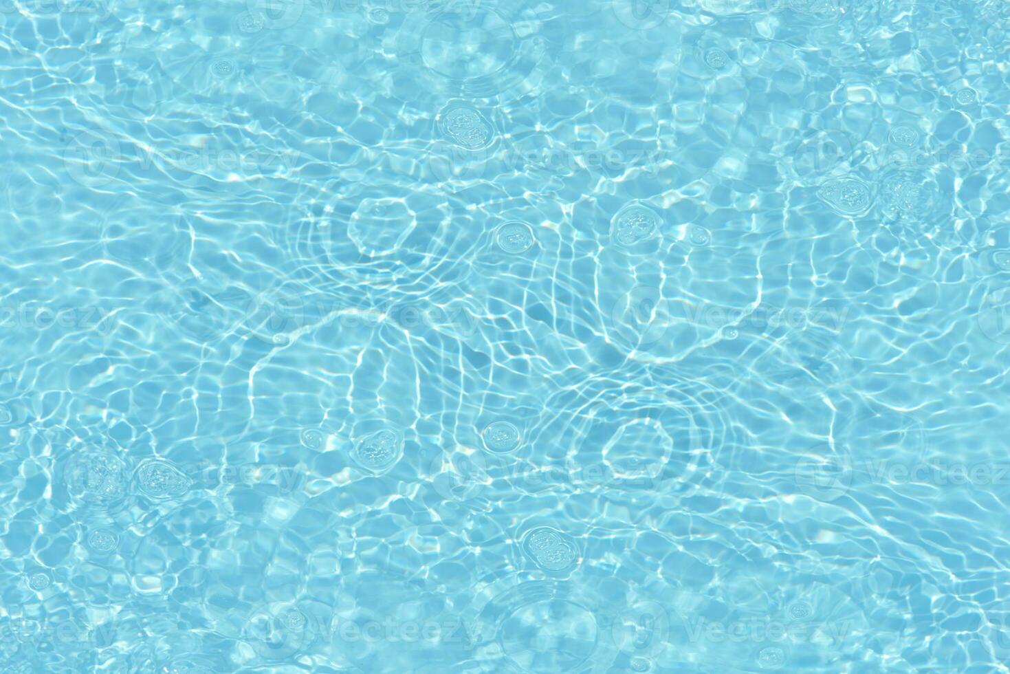 Blue water with ripples on the surface. Defocus blurred transparent white-black colored clear calm water surface texture with splash and bubbles. Water waves with shining pattern texture background. photo