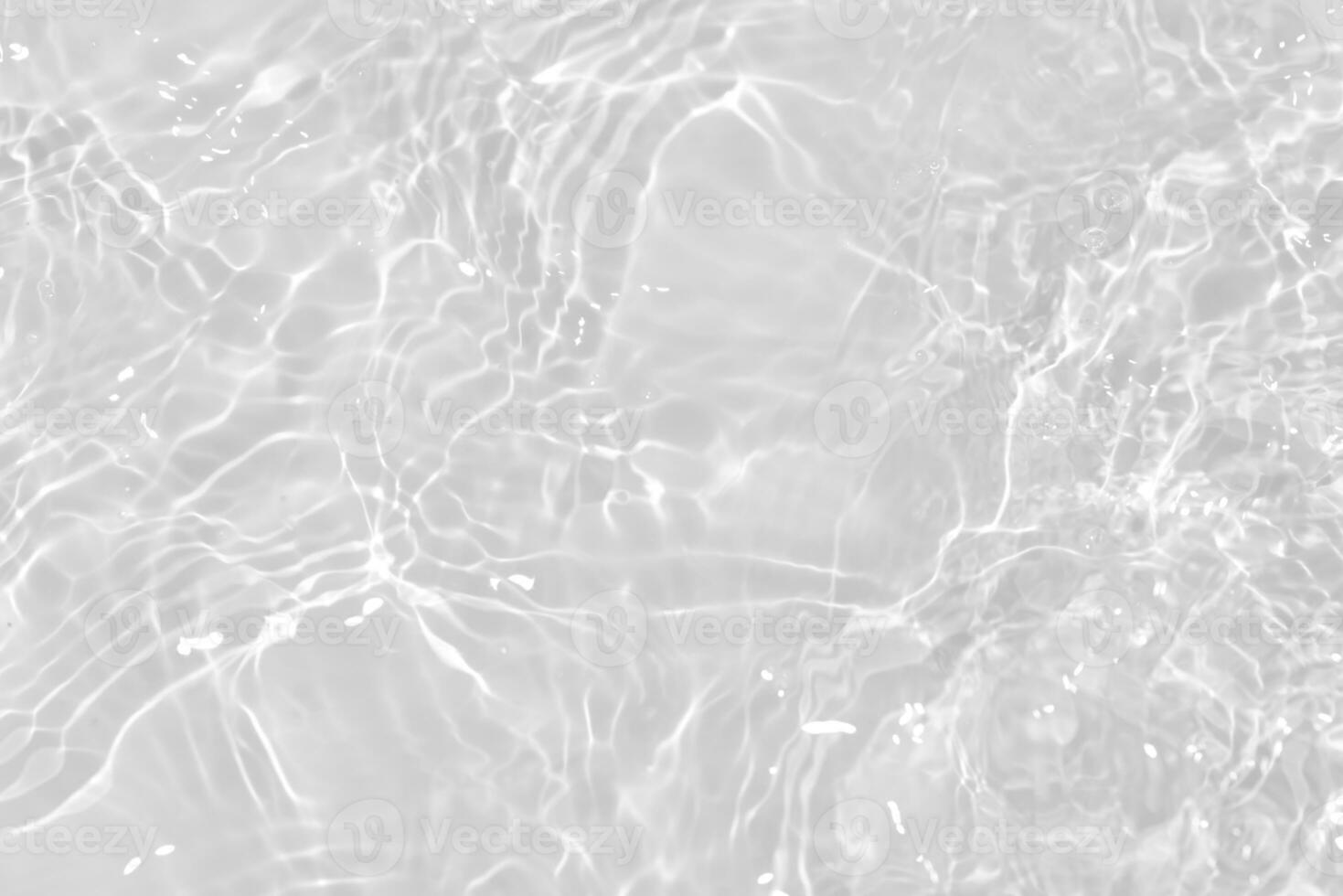 White water with ripples on the surface. Defocus blurred transparent white colored clear calm water surface texture with splashes and bubbles. Water waves with shining pattern texture background. photo