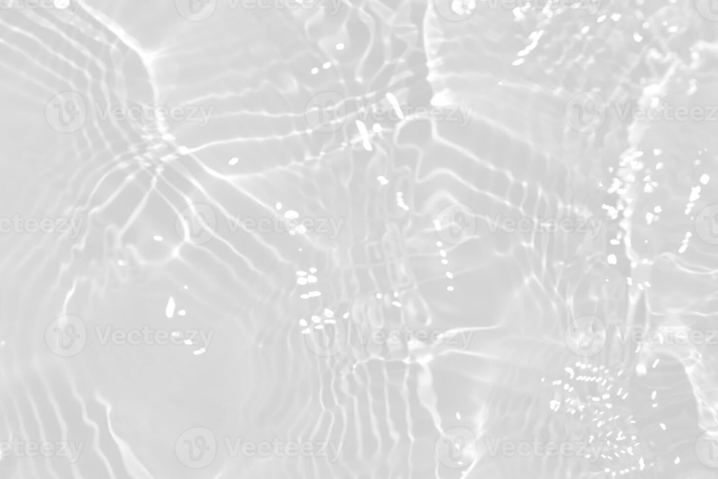 White water with ripples on the surface. Defocus blurred transparent white colored clear calm water surface texture with splashes and bubbles. Water waves with shining pattern texture background. photo