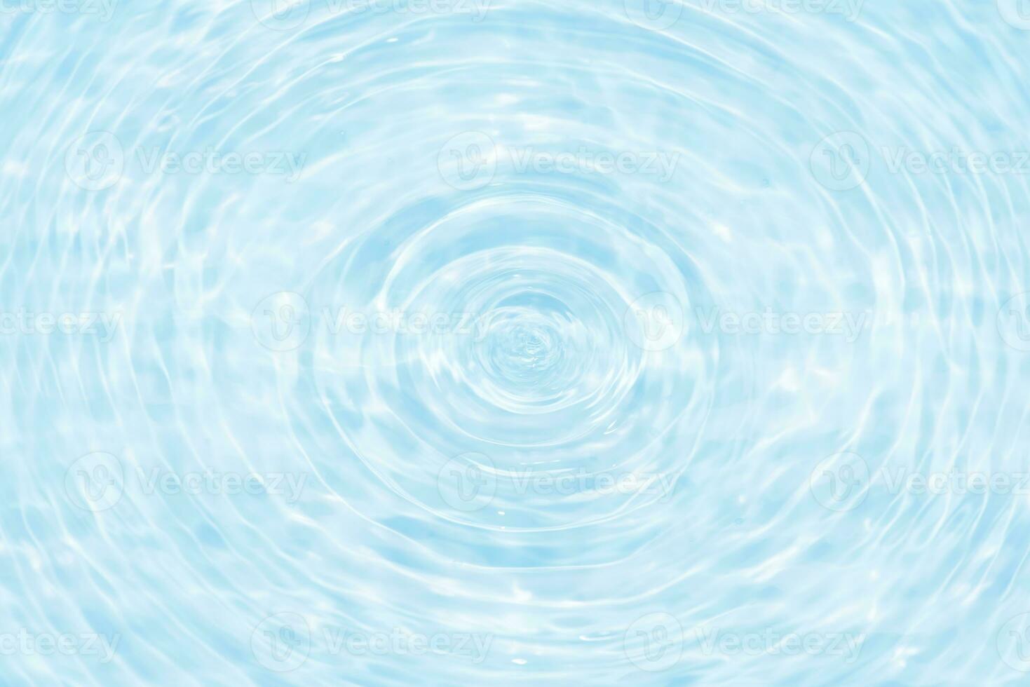 Defocus blurred transparent blue colored clear calm water surface texture with splashes reflection. Trendy abstract nature background. Water waves in sunlight with copy space. Blue watercolor shine. photo