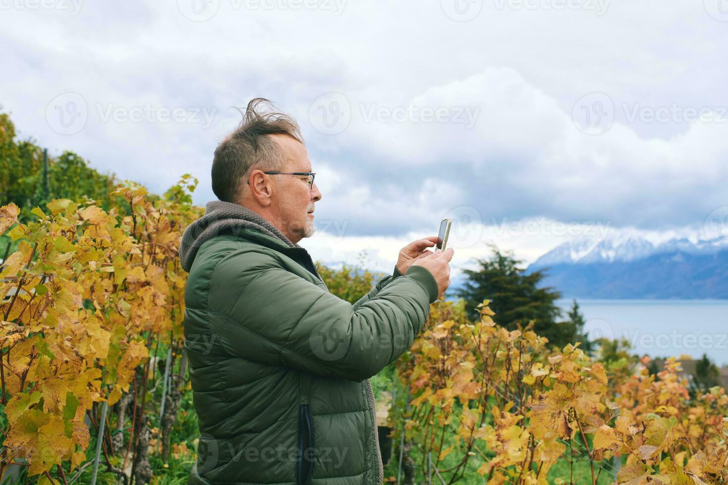 Outdoor portrait of middle age 55 - 60 year old man enjoing nice autumn day in vineyards, healthy and active lifestyle photo