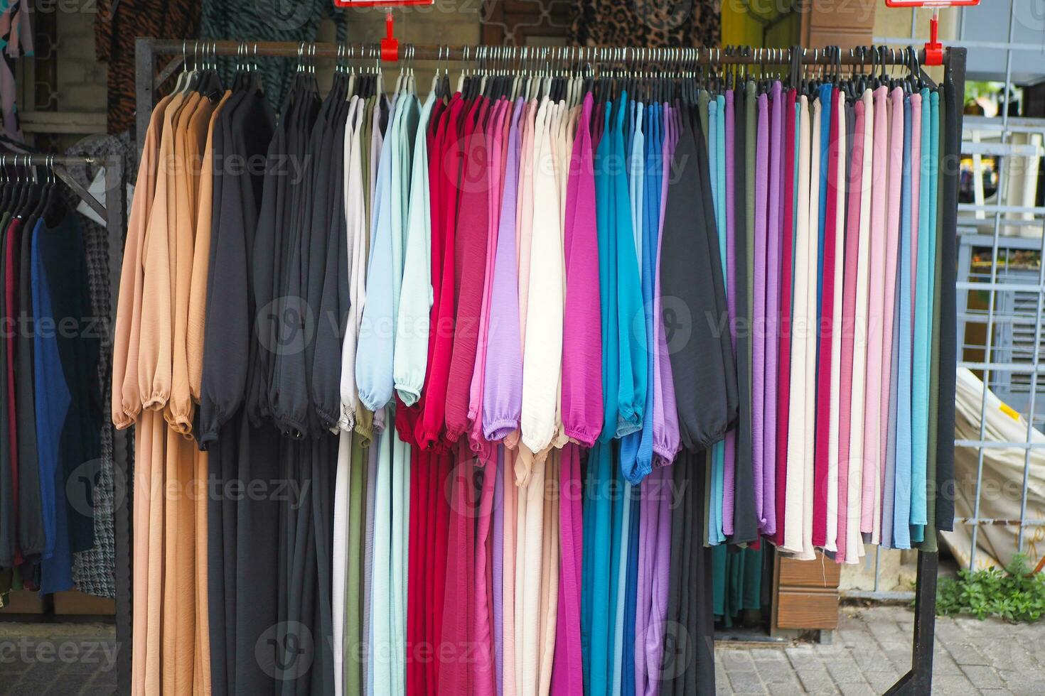 close up of many women cloths display for sale photo