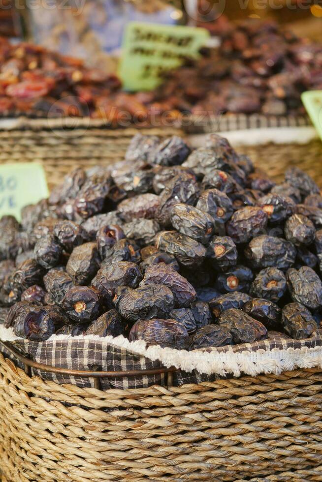 many date fruits display for sale at local market photo