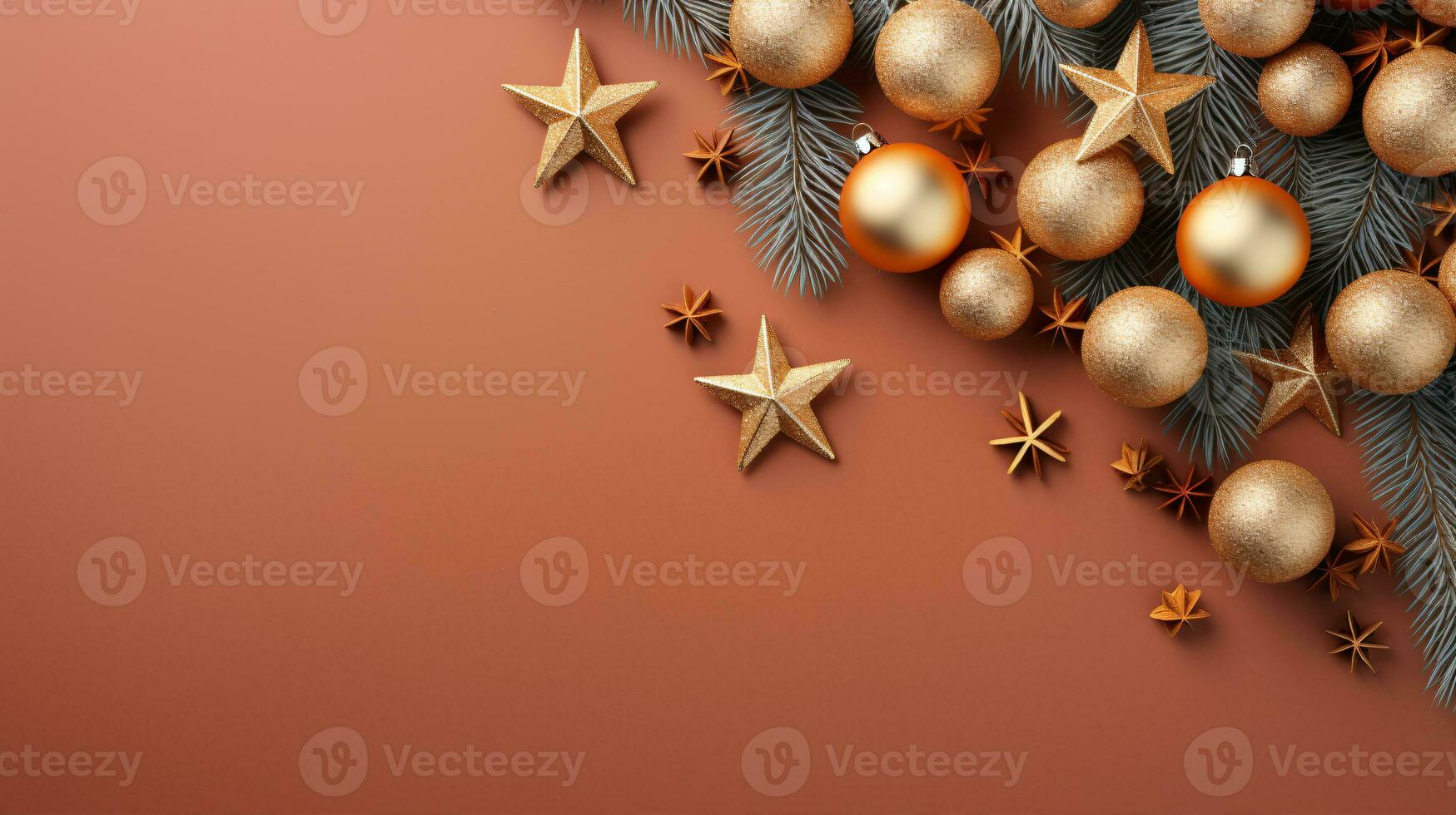 Festive ornaments, like gold and red stars amongst fir branches, isolated on a brown surface for creative flat lay Christmas concepts. photo