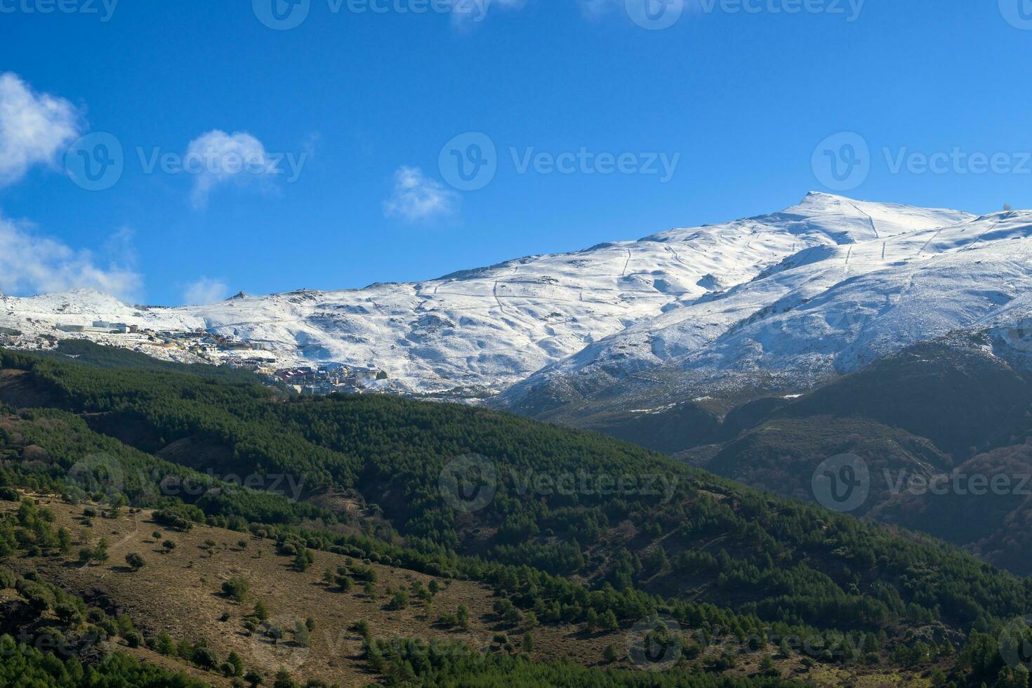 Ski slopes of Pradollano ski resort in Sierra Nevada mountains in Spain photo