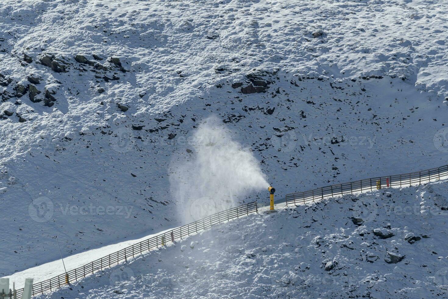 Snow cannon gun or machine sprays water and snowes a ski or cross-country  track 27596714 Stock Photo at Vecteezy