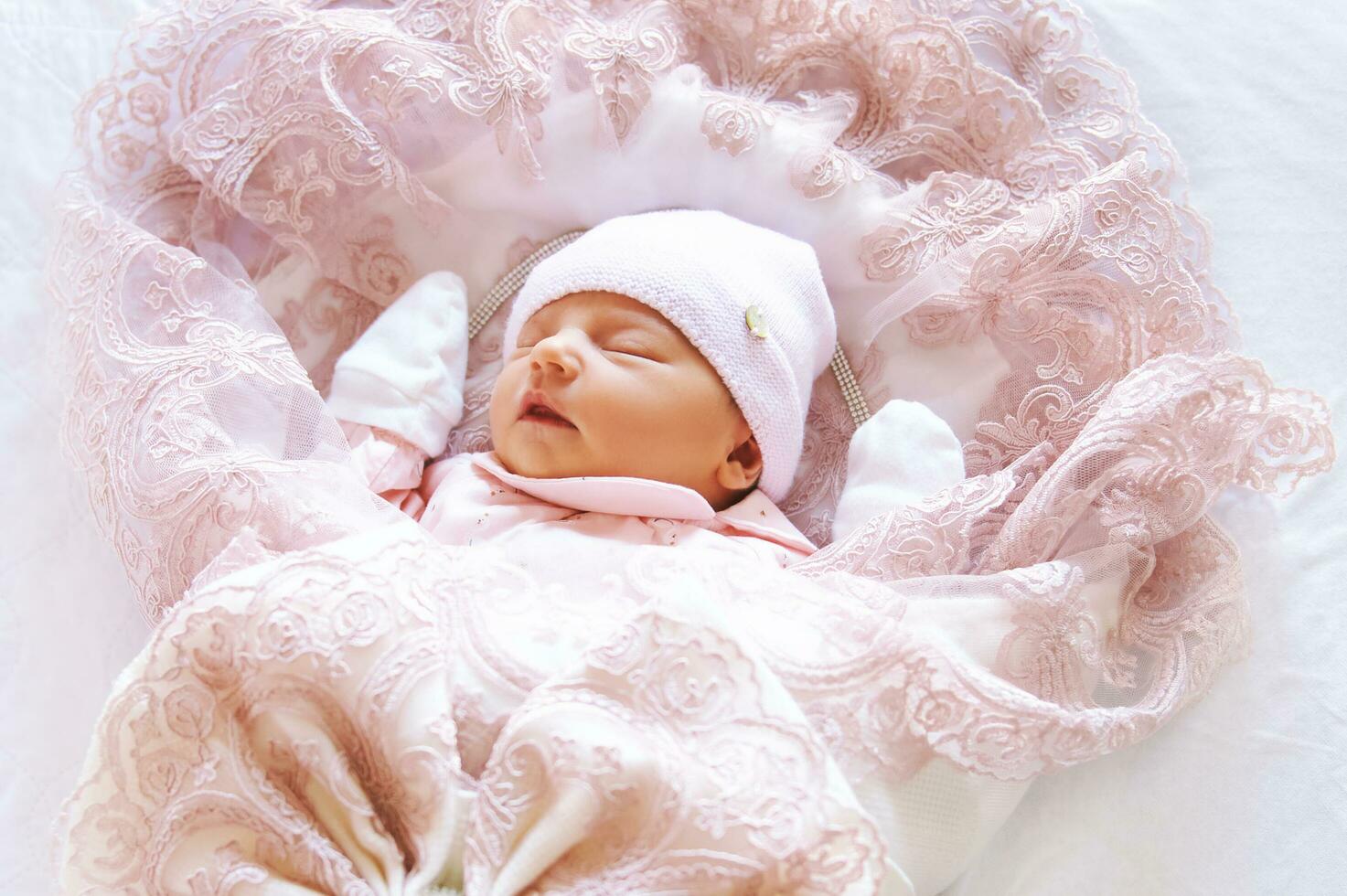 Close up portrait of adorable sleeping newborn baby girl photo