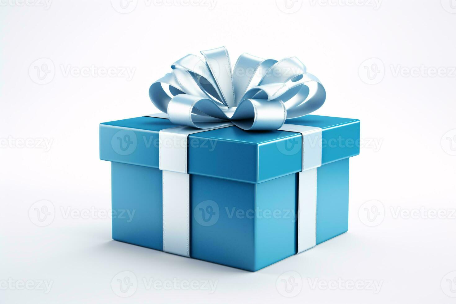 An isolated blue gift box, tied with a ribbon, on a white surface. photo