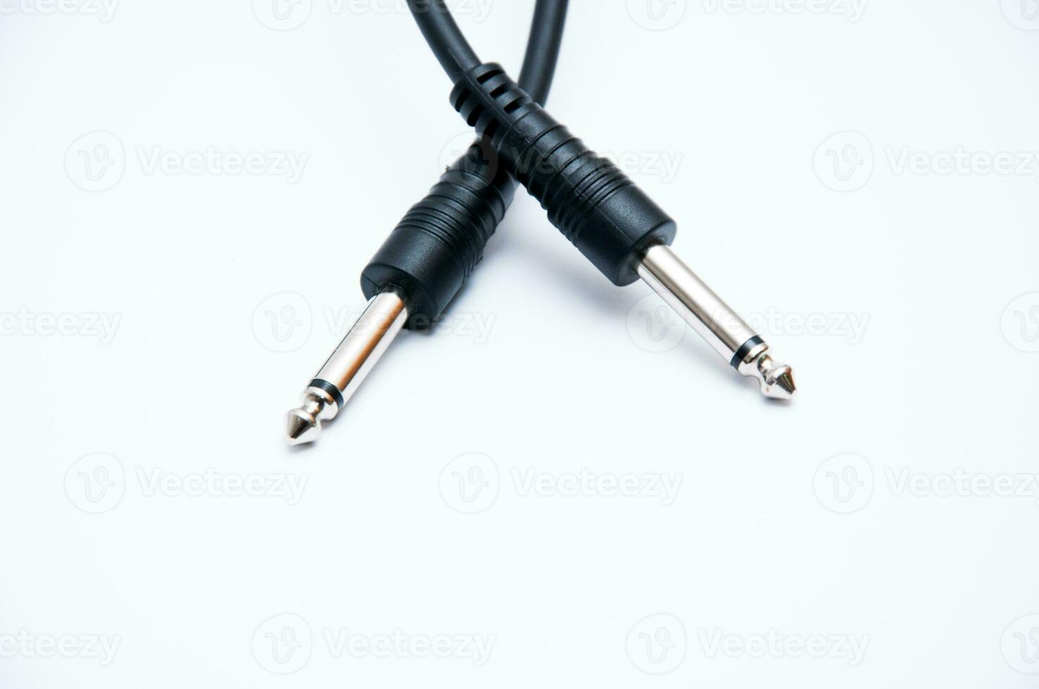 Two sound jacks with a cord on a white background photo