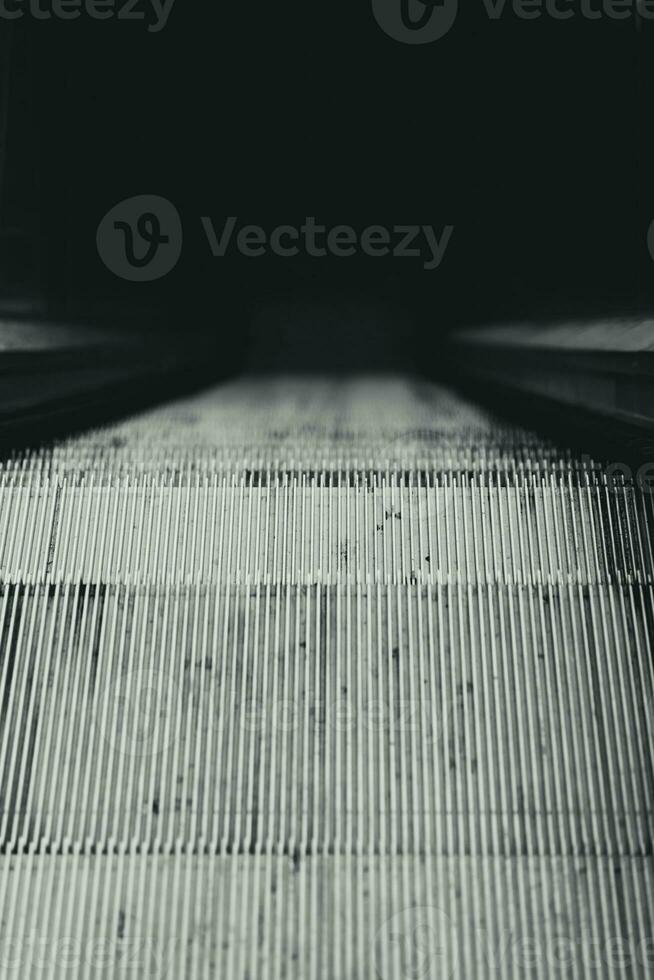 Grey and dirty metal escalator photo