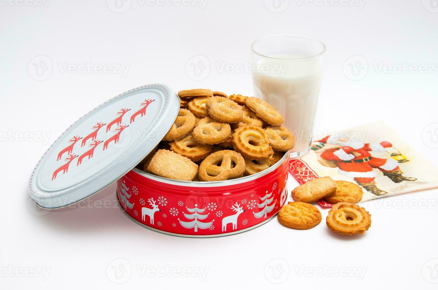 Christmas cookies in the box and glass of milk photo