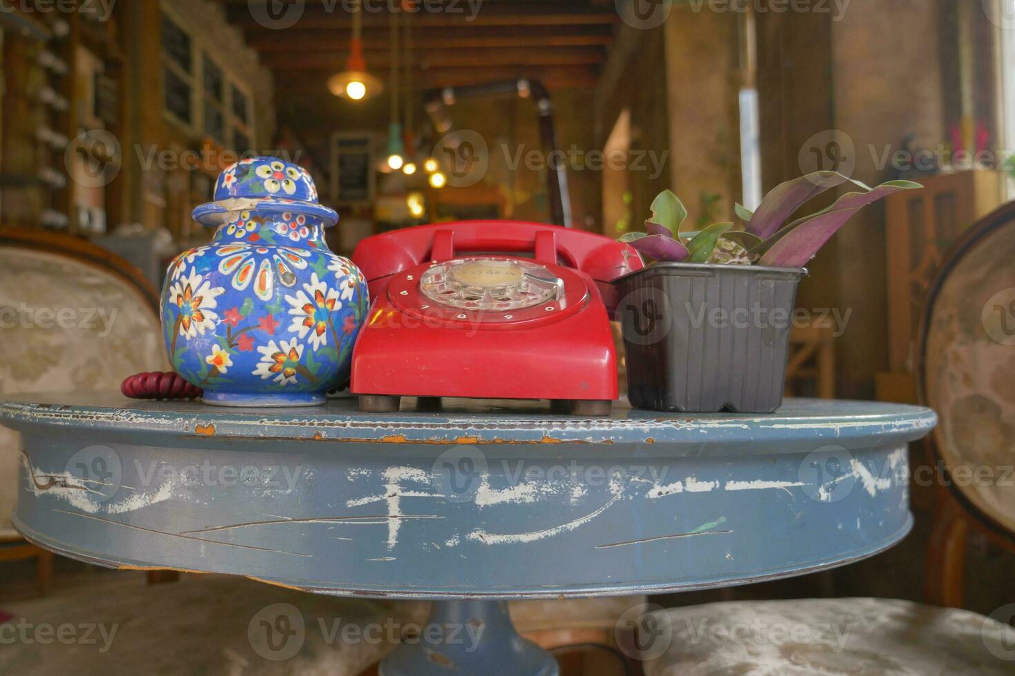 red color Retro telephone on table. photo