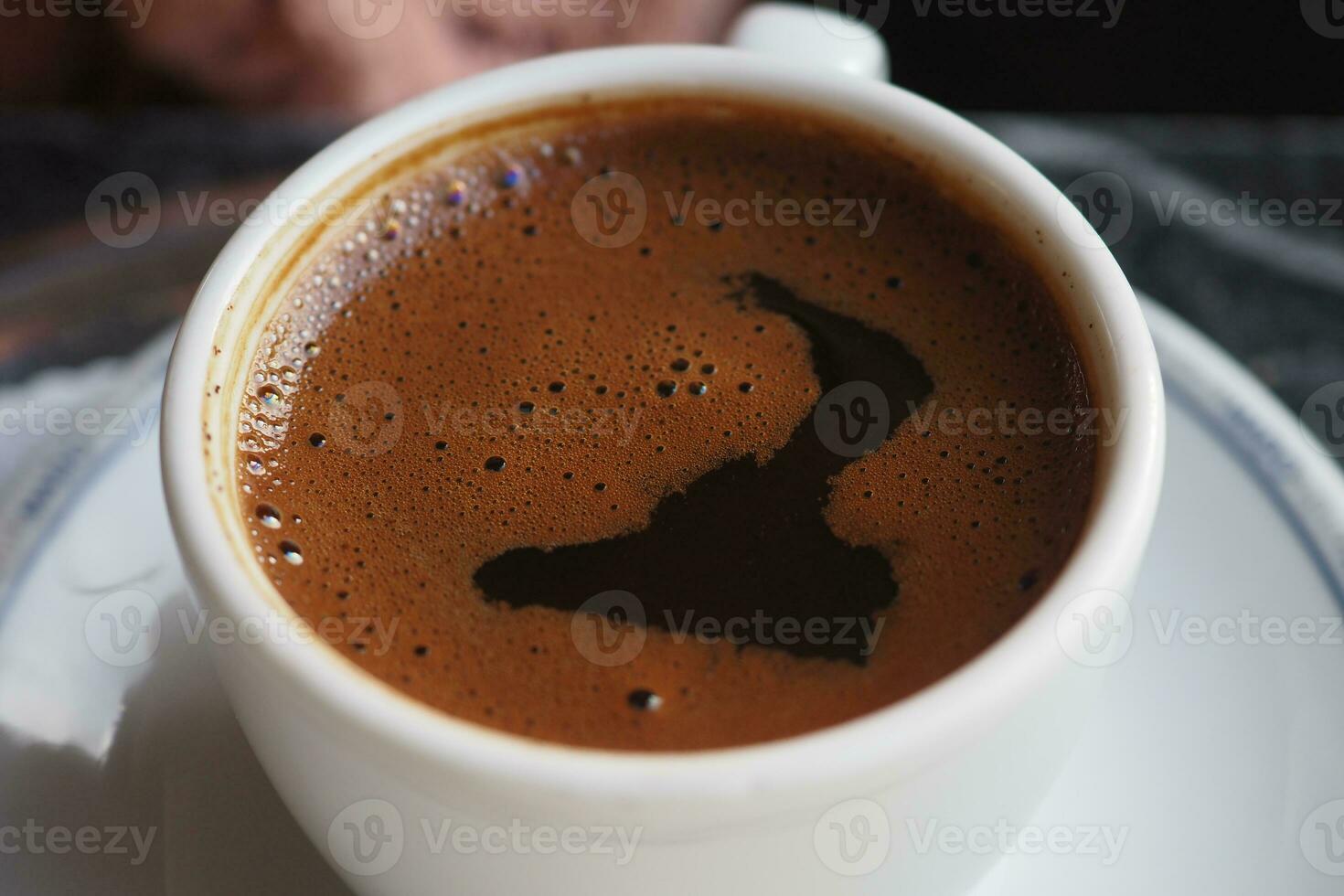 a cup of turkish coffee on table photo