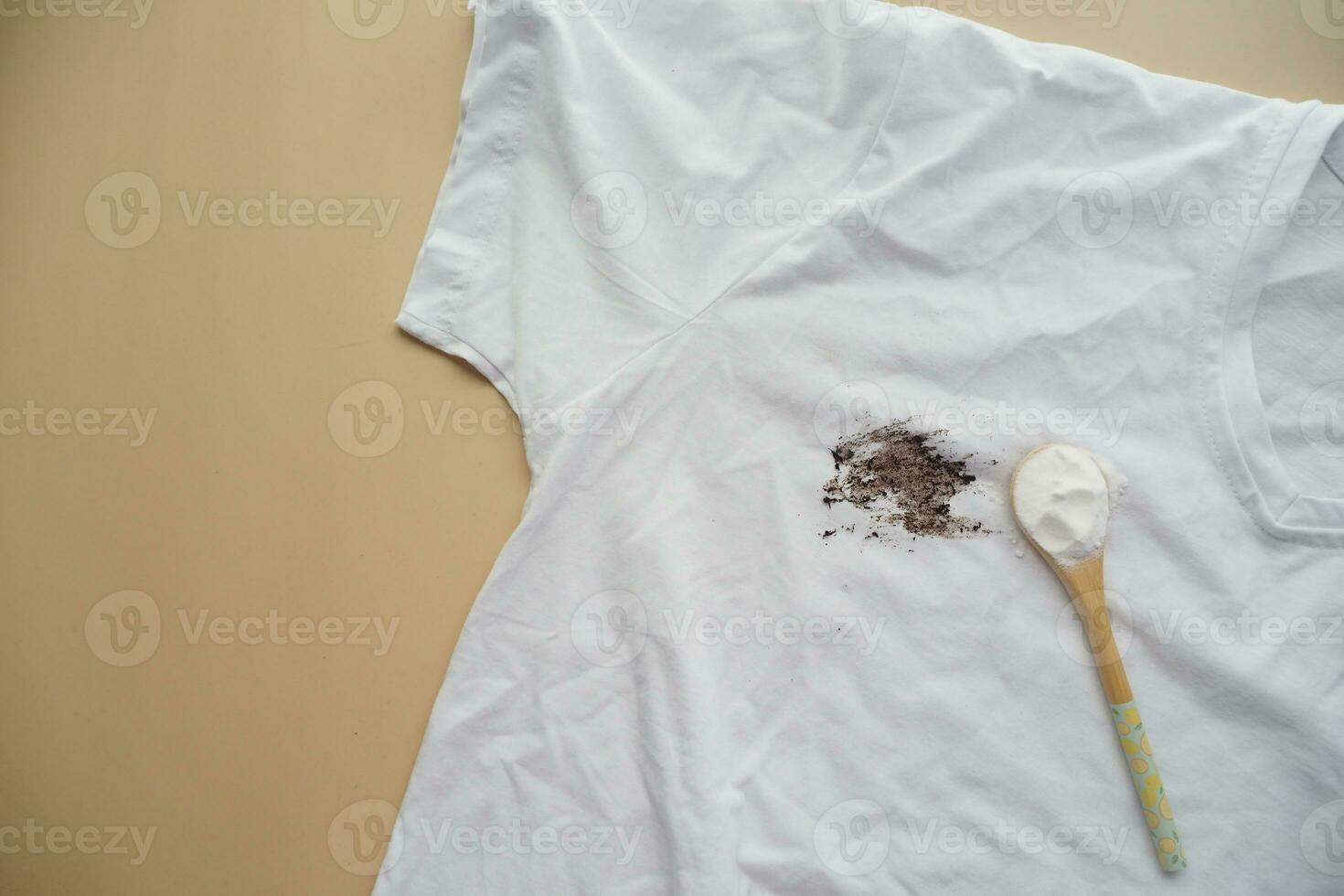 removing stain on clothes with biocarbonat. photo