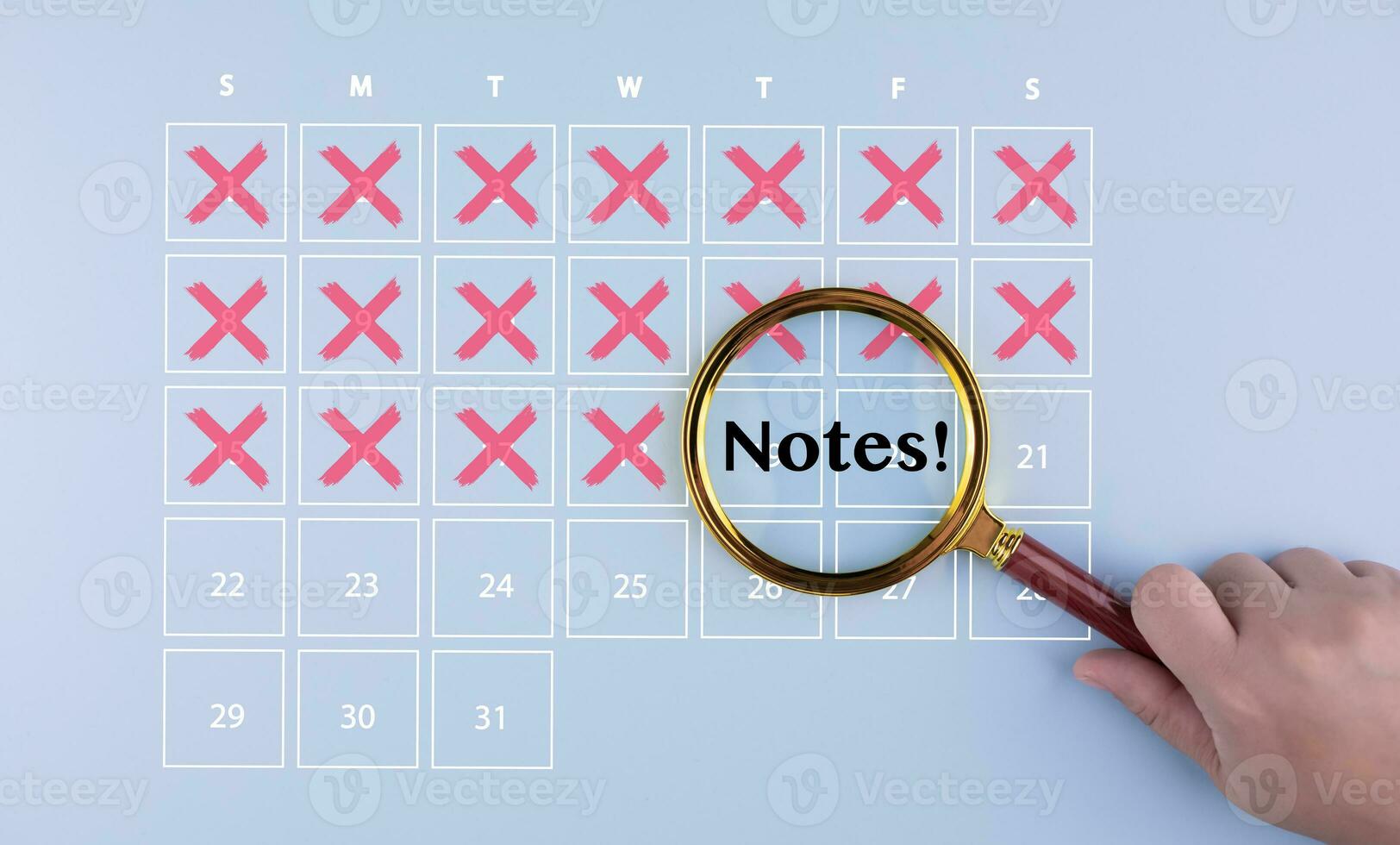 Handhold the Magnifying glass focus schedule calendar in the agenda reminder and Vacation travel in the calendar reminder event concept. The red cross marked with pen on a calendar sheet, photo