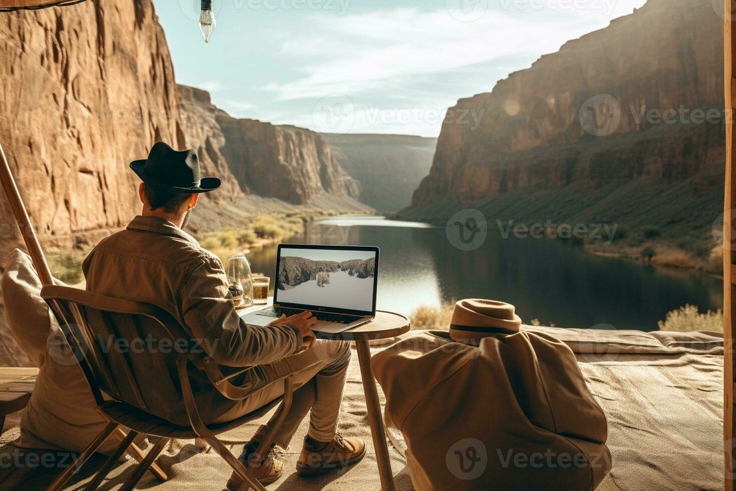 AI generated man working in front of laptop in beautiful place photo