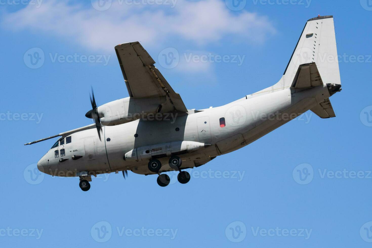 Untitled military transport plane at air base. Airport and airfield. Air force and army flight operation. Aviation and aircraft. Air lift. Military industry. Fly and flying. photo