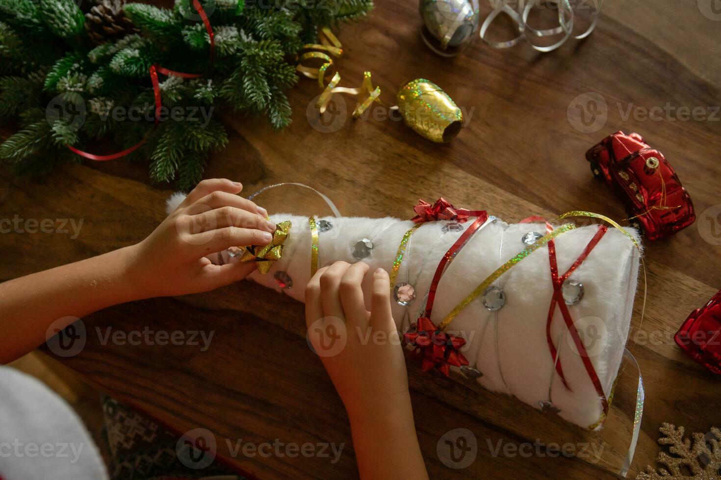 Boy makes craft. child makes decorations for Christmas tree, makes Christmas tree himself, DIY. photo. handmade. view from above photo