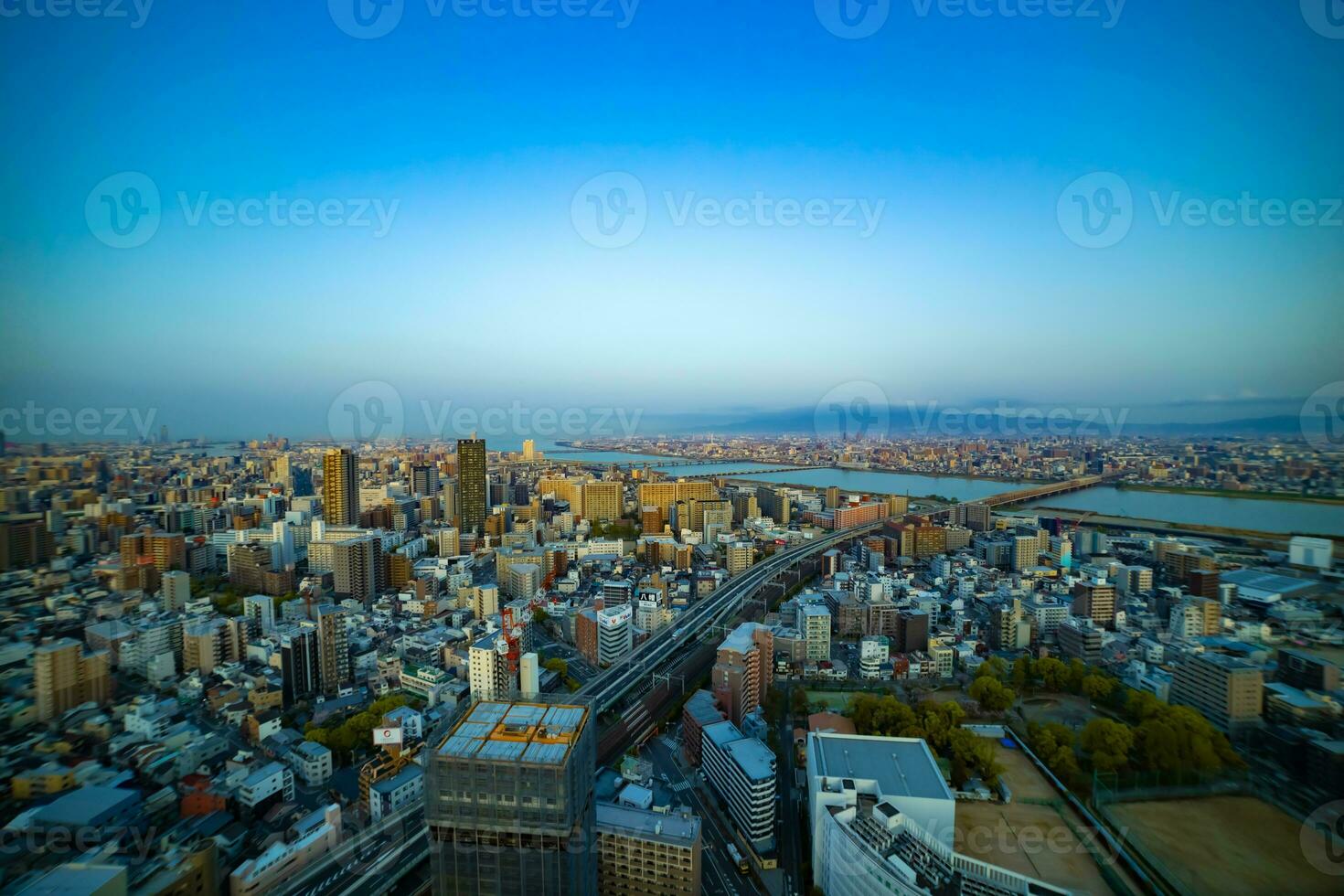 A panoramic cityscape near Yodo river in Osaka wide shot photo