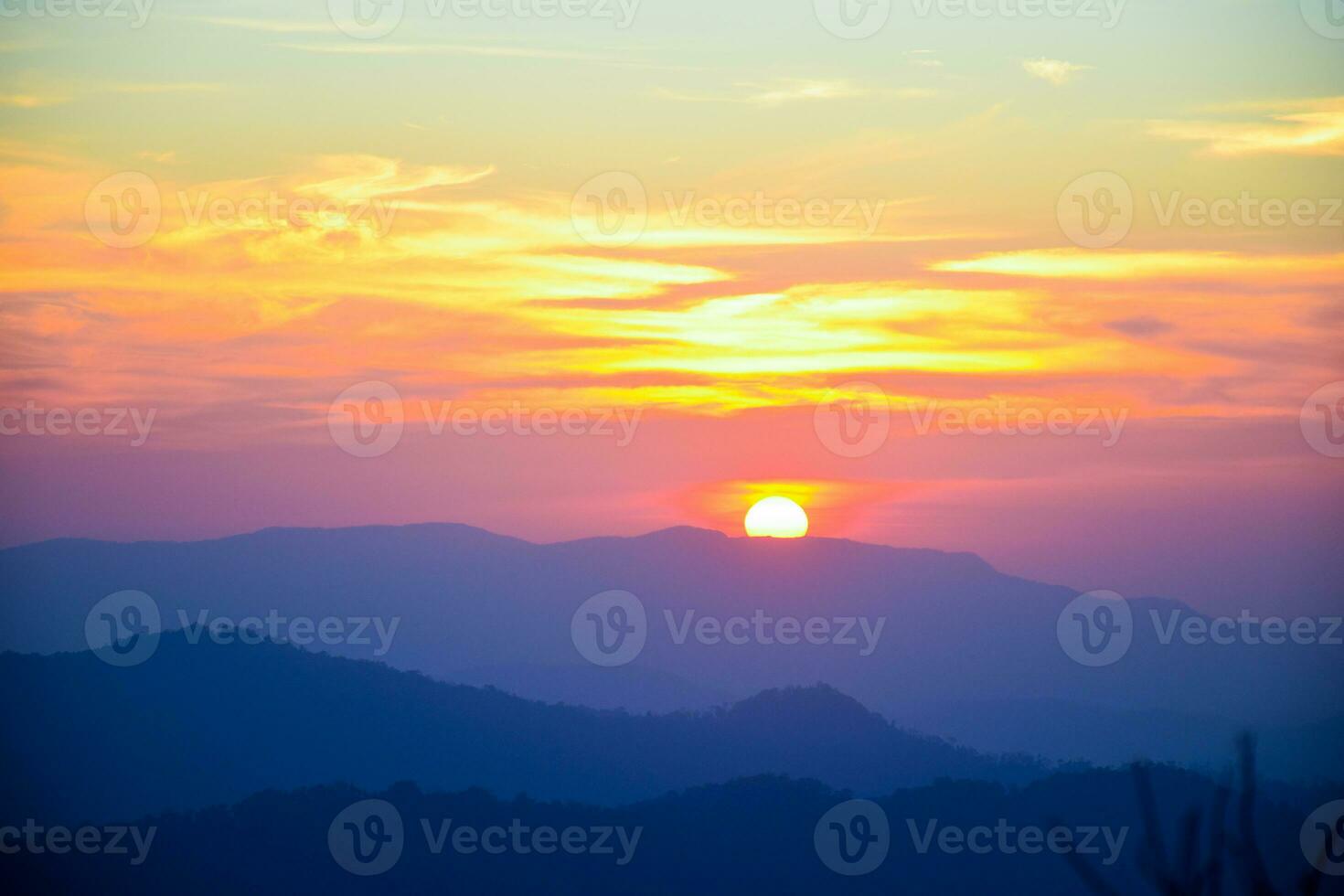 sunset on top of the mountain photo