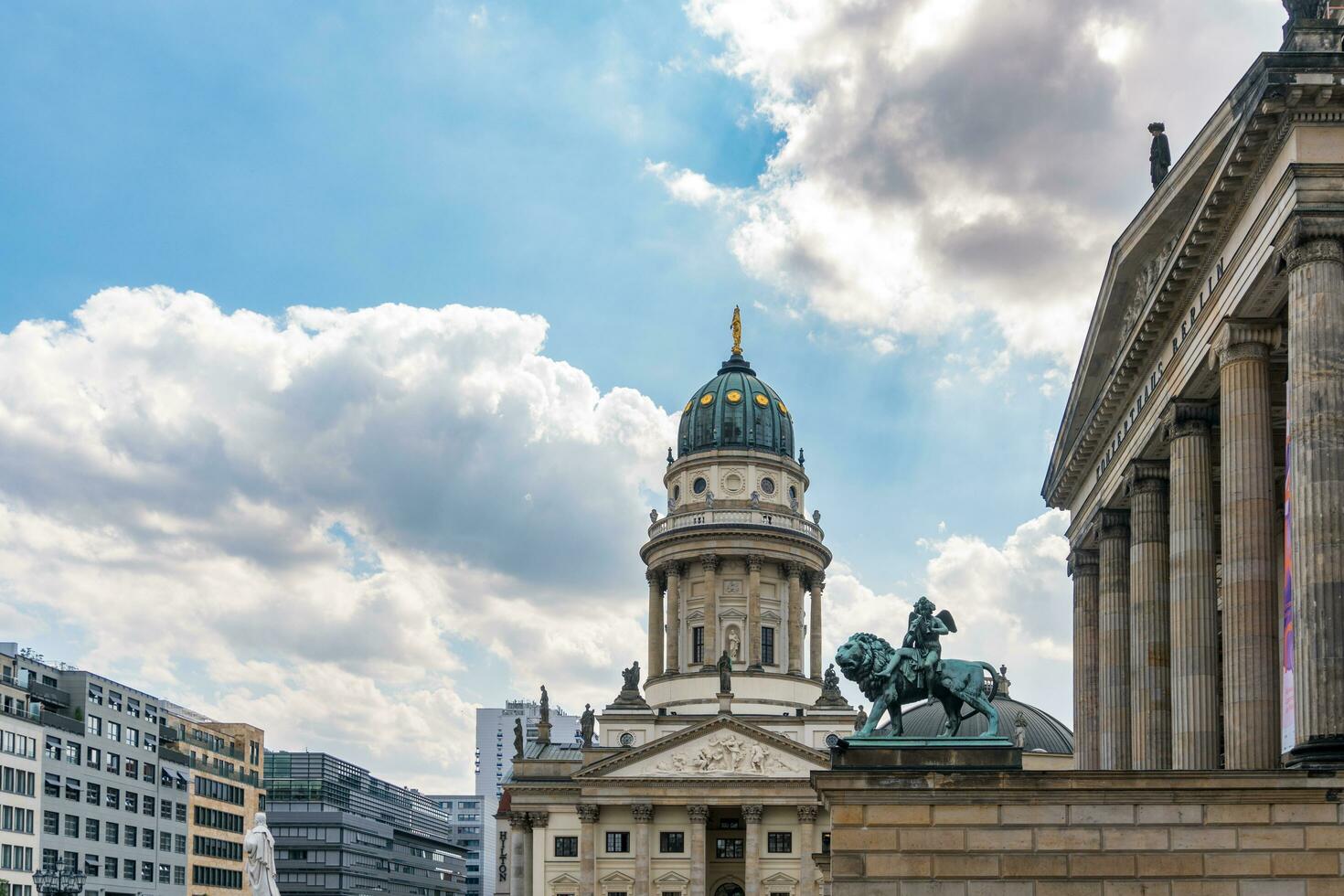 Berlin, Germany-august 9, 2022-view of one of the two churches in Gendarmenmarkt square during a cloudy day photo