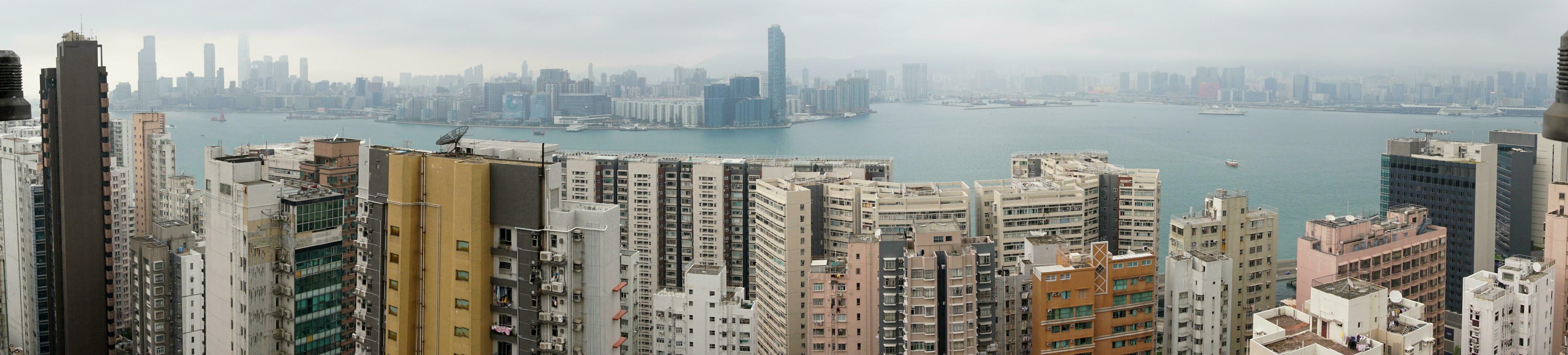 Hong Kong,March 26,2019-Panorama of skyscrapers of hong kong bay during a hazy day photo
