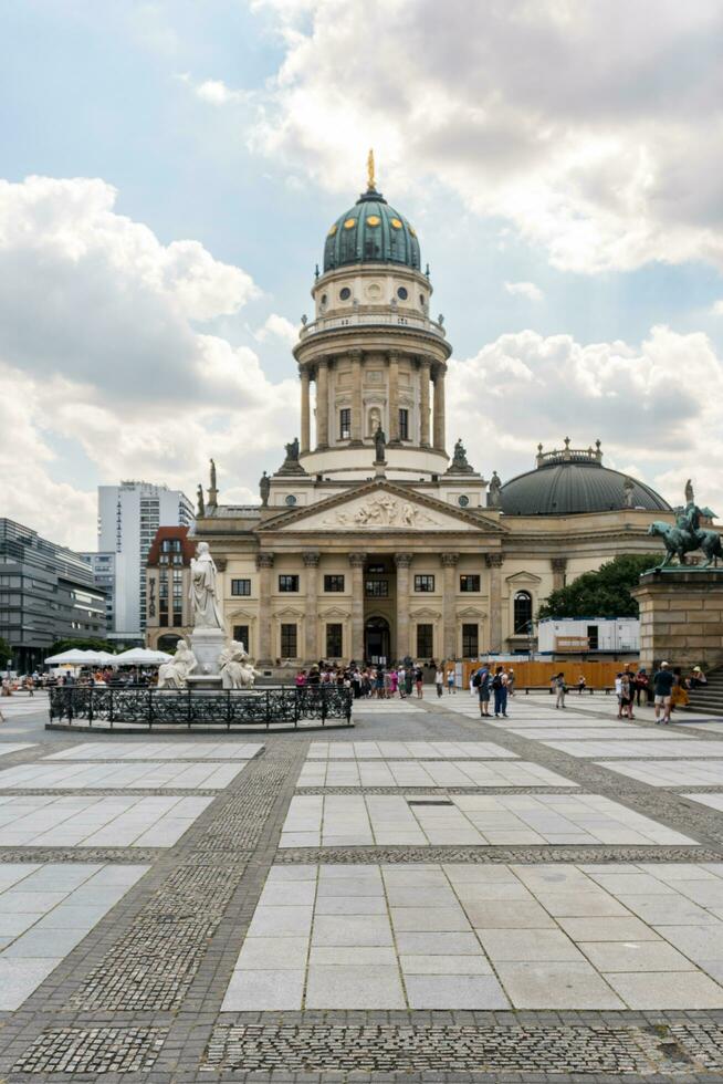 Berlin, Germany-august 9, 2022-view of one of the two churches in Gendarmenmarkt square during a cloudy day photo