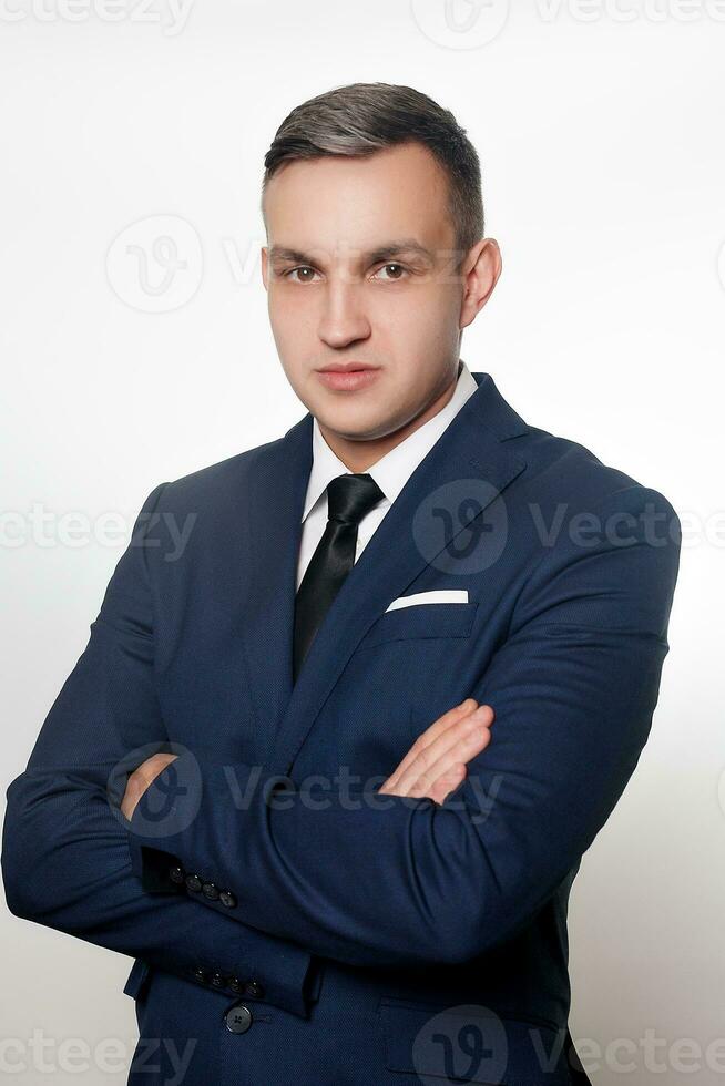 Portrait of handsome man in black blue suit photo