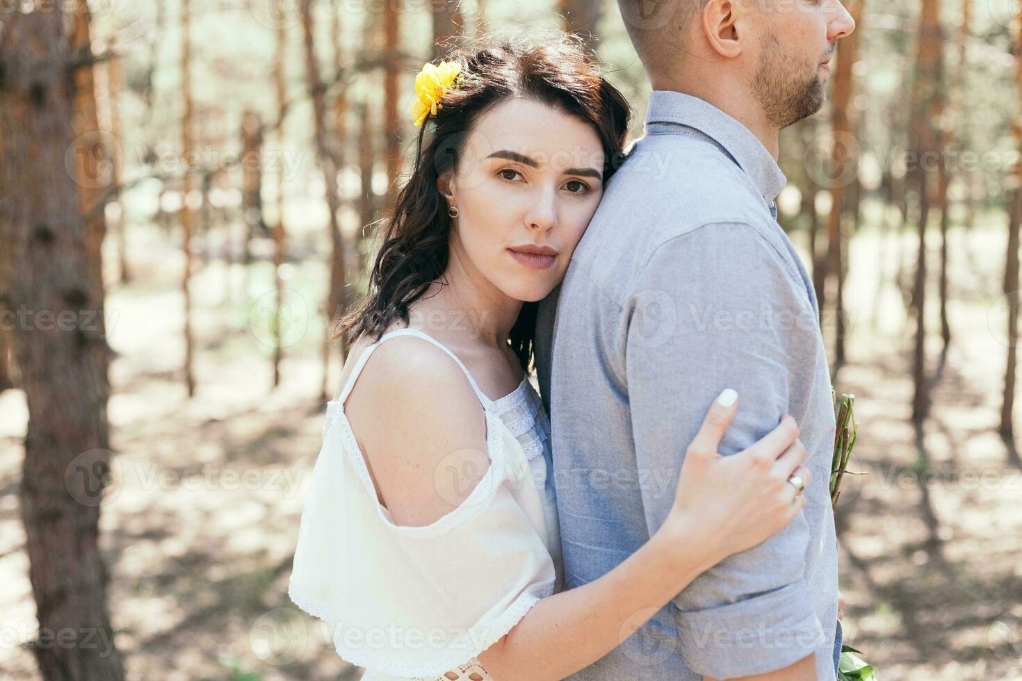 Wedding walk in the pine forest. Sunny day. photo