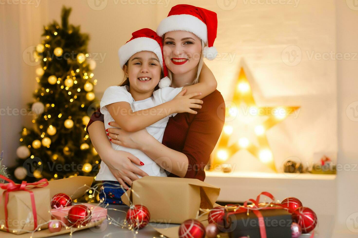 holidays, presents, christmas, x-mas, birthday concept - happy mother and child girl with gift box photo